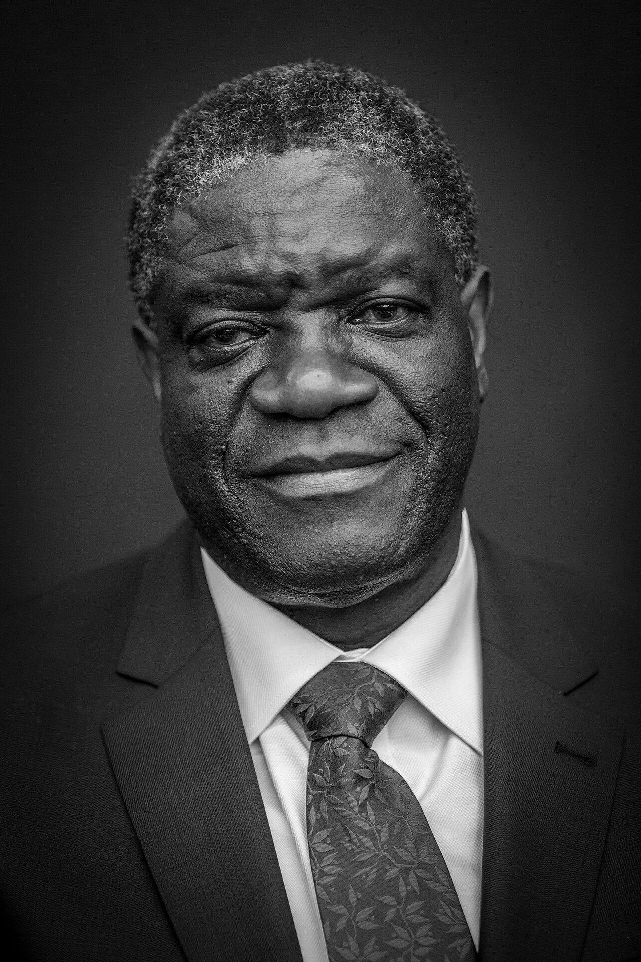 Black-and-white portrait of Denis Mukwege in a suit and tie.