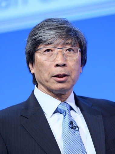Patrick Soon-Shiong in glasses and a blue tie, speaking.
